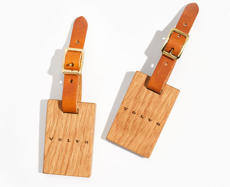 Wooden luggage tags engraved with the Volvo logo
