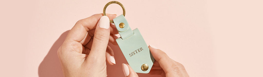 Leather 'Sister' keyring with female hand model