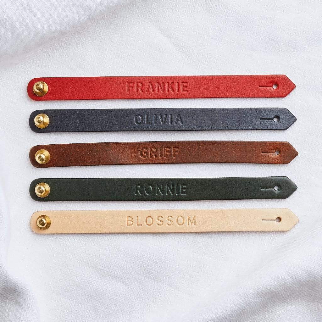 Five leather bracelets stamped with personalised names