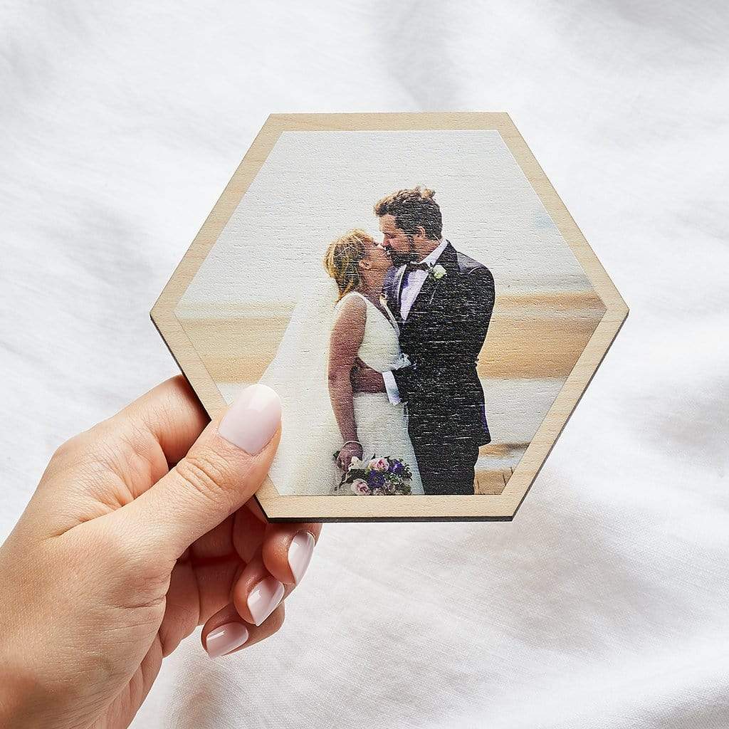 Photo of bride and groom printed on a wooden hexagon tile