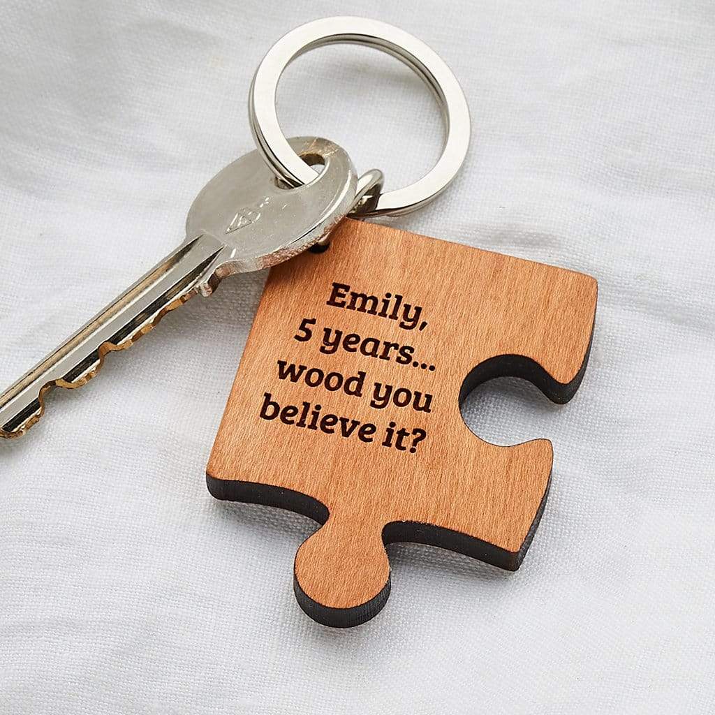 Jigsaw shaped wooden keyring engraved 'Emily, 5 years...wood you believe it?'