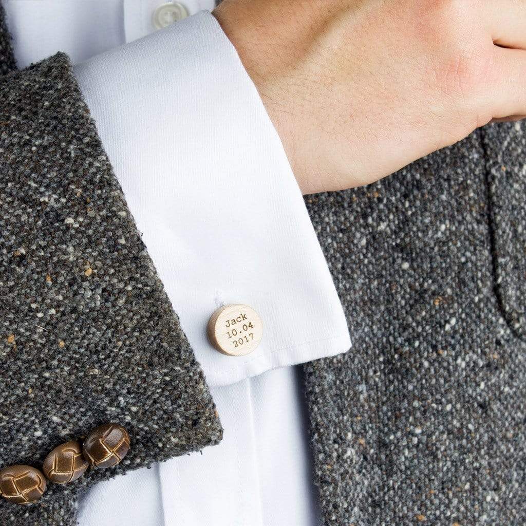 Personalised wooden cufflinks shown on a man's shirt sleeve