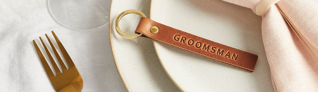 Brown leather keyring stamped 'Groomsman'