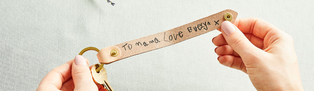 Leather keyring printed with a child's handwritten message