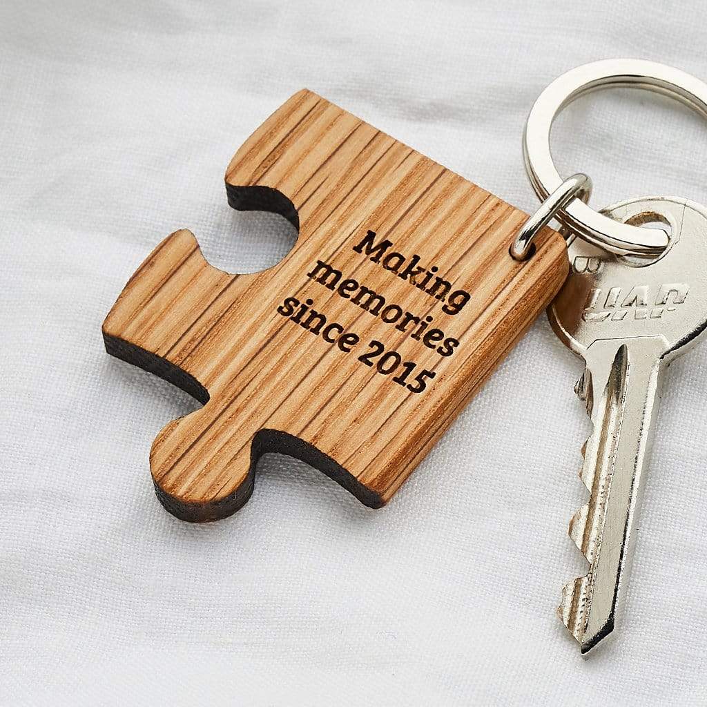Jigsaw shaped wooden keyring engraved with 'making memories since 2015'