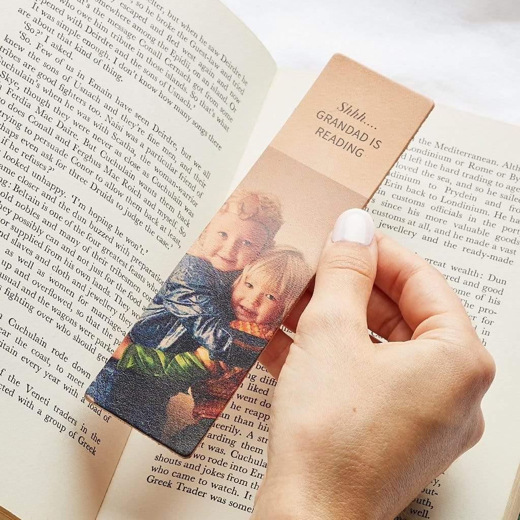 Leather bookmark printed with a photo of two children and the message 'Shhh...Grandad is reading'