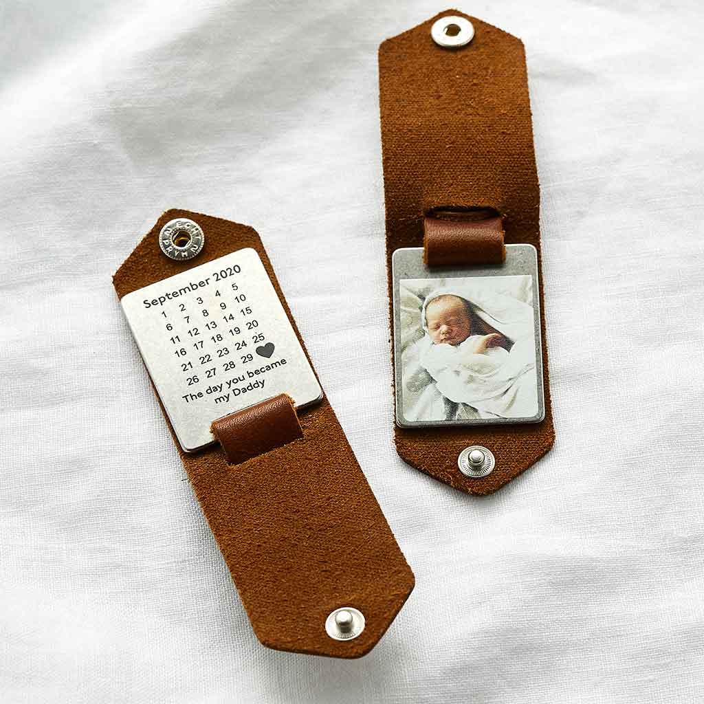 Brown leather keyring personalised with baby photo and engraved calendar design