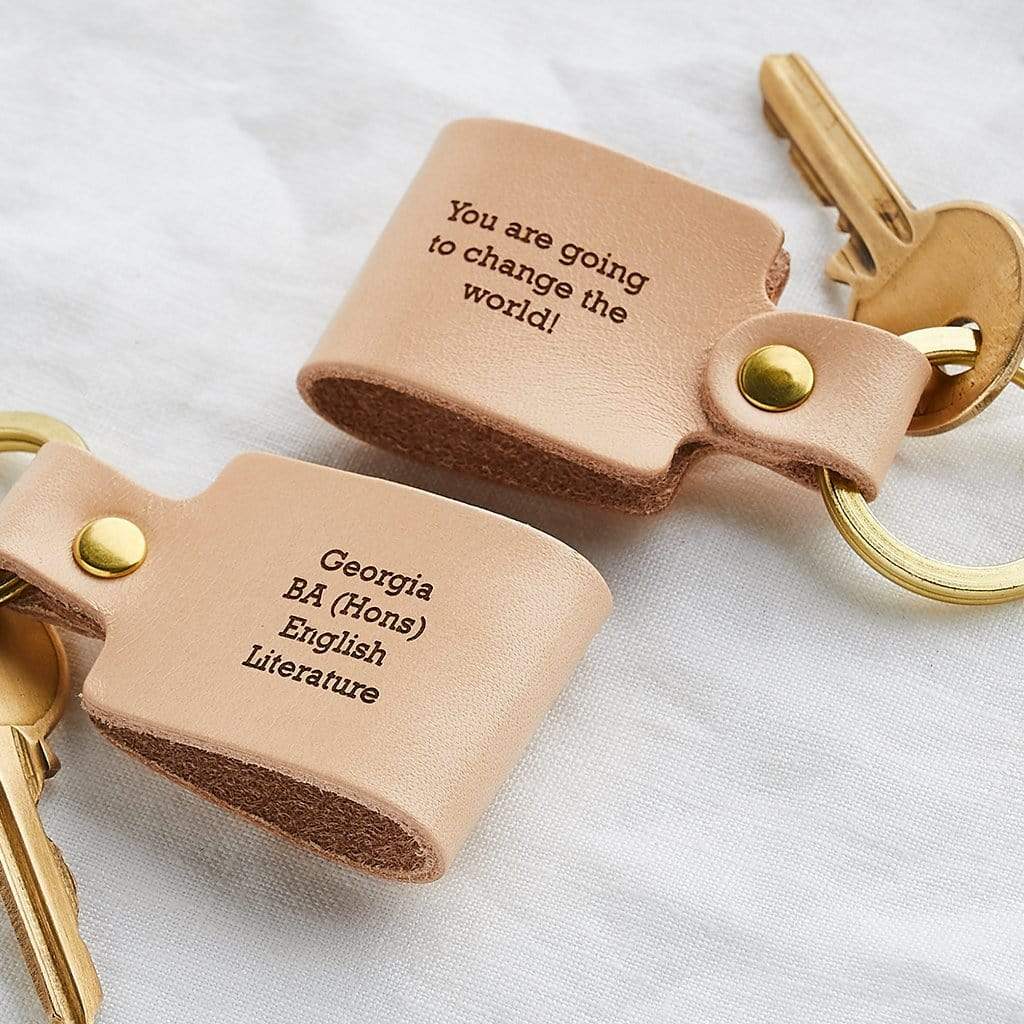 Pair of personalised leather keyrings with engraved messages