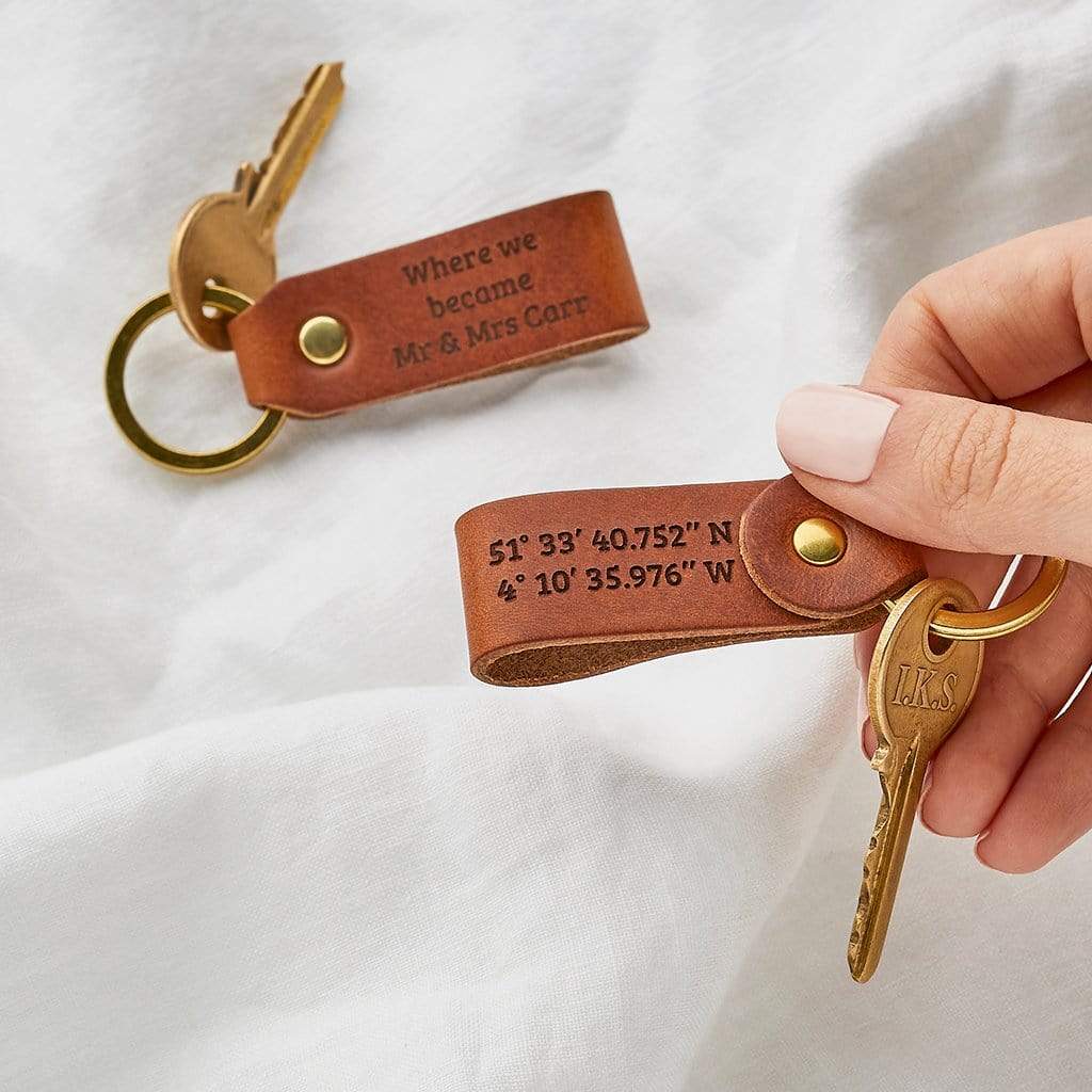Pair of leather keyrings engraved with coordinates