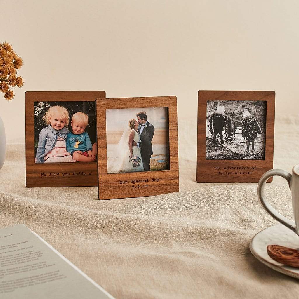 Three wooden photo frames engraved with personalised messages