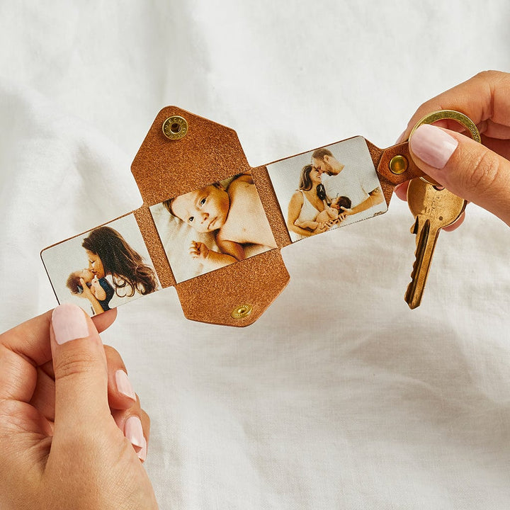 Brown leather keyring holding three photographs