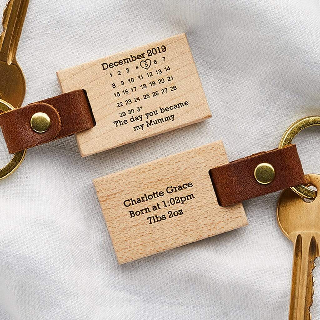 Wooden keyrings engraved with a calendar design and personalised date and message
