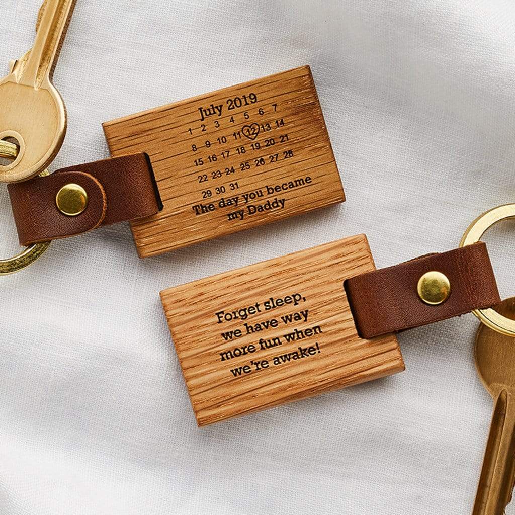 Wooden keyrings engraved with a calendar design and personalised date and message