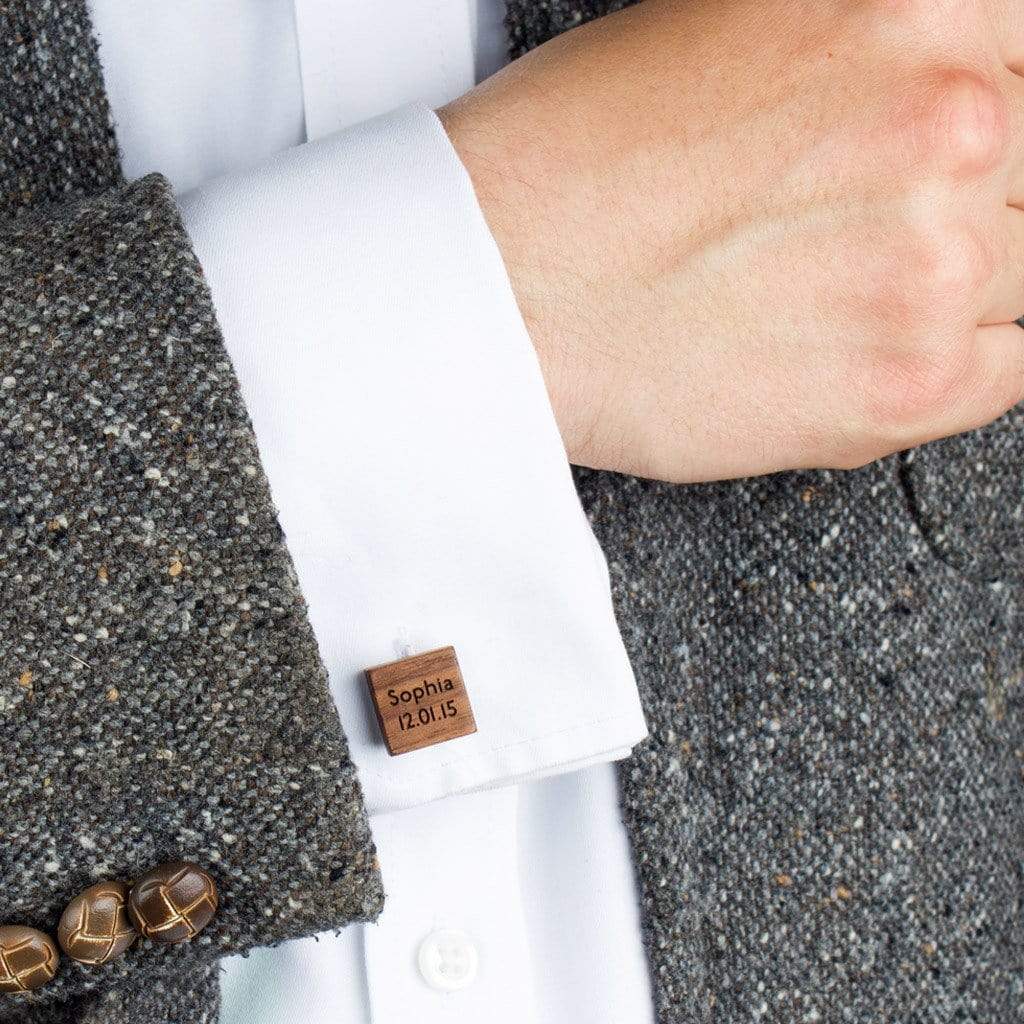 Personalised wooden cufflink shown on a man's shirt sleeve